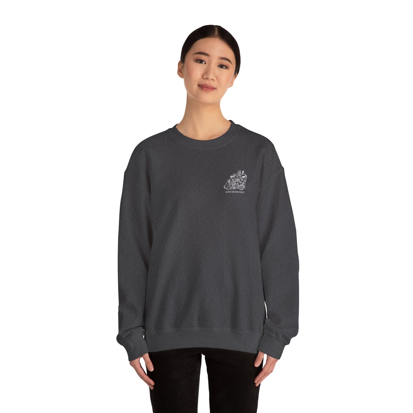 LOVE NEVER FAILS Unisex Heavy Blend™ Crewneck Sweatshirt